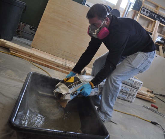 pouring-concrete-into-counter-mold