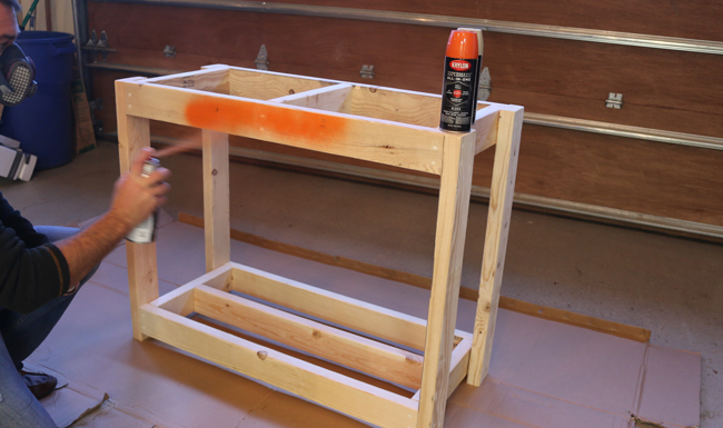 spray painting firewood storage rack