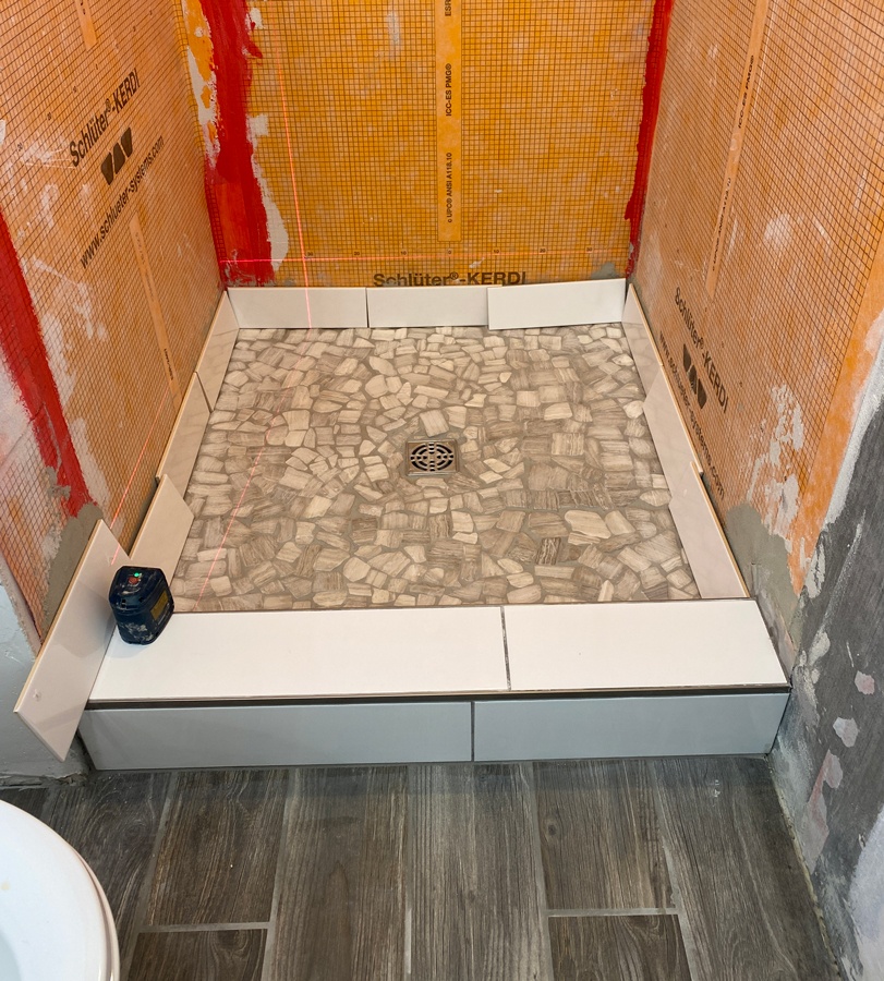 shower floor in small bathroom
