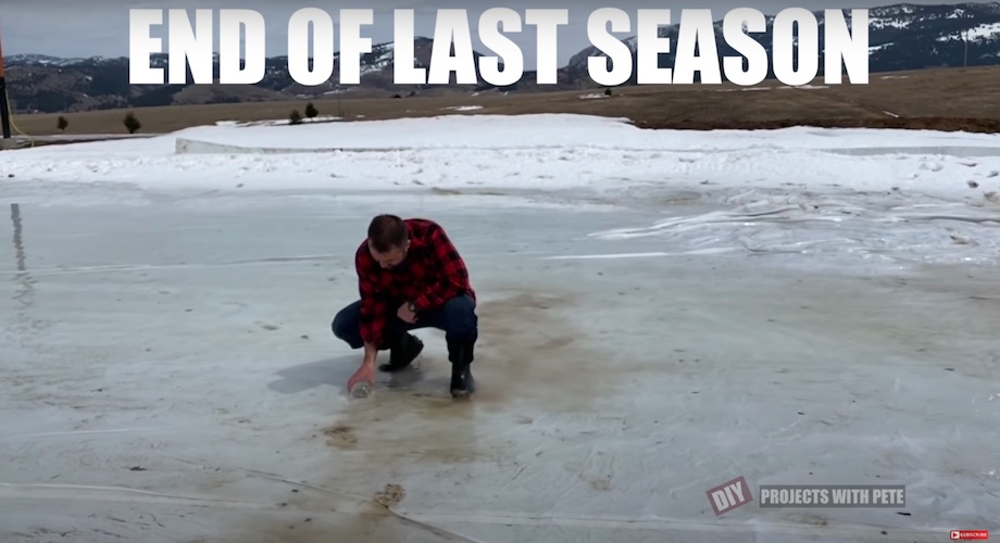 DIY Pete collecting a jar of water from last year's melted ice rink