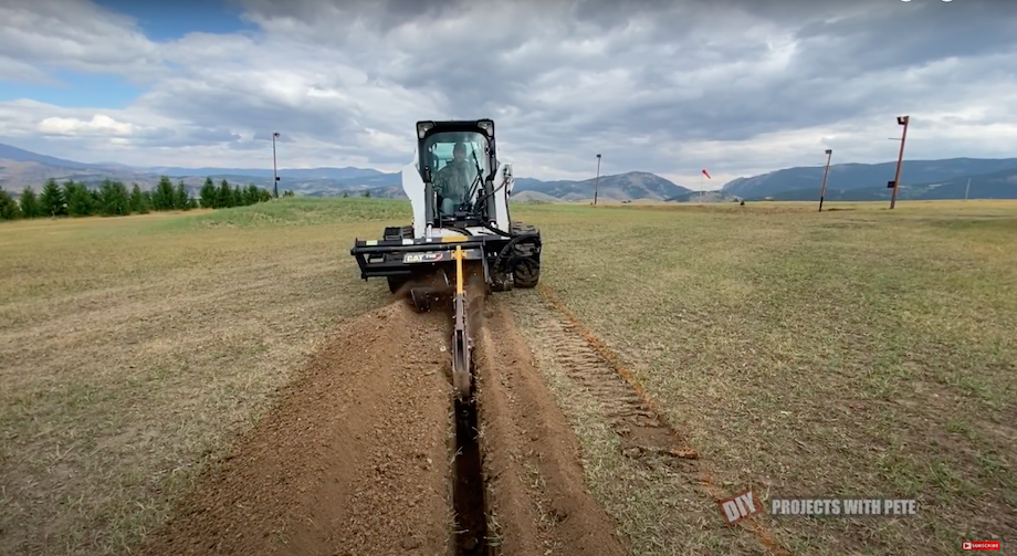 Trenching electrical lines with skid steer