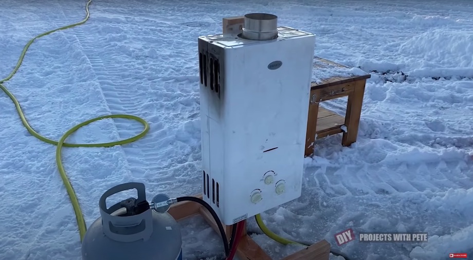 Portable hot water propane heater for a hose