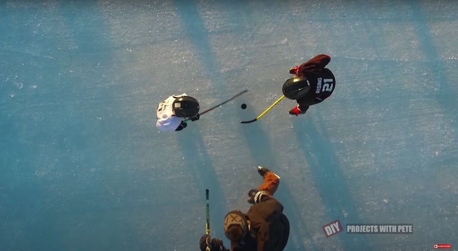 Kids faceoff puck drop on DIY outdoor hockey rink