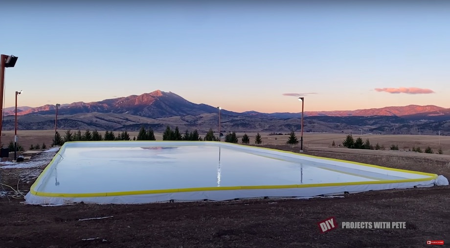 A hockey rink full of water before freezing